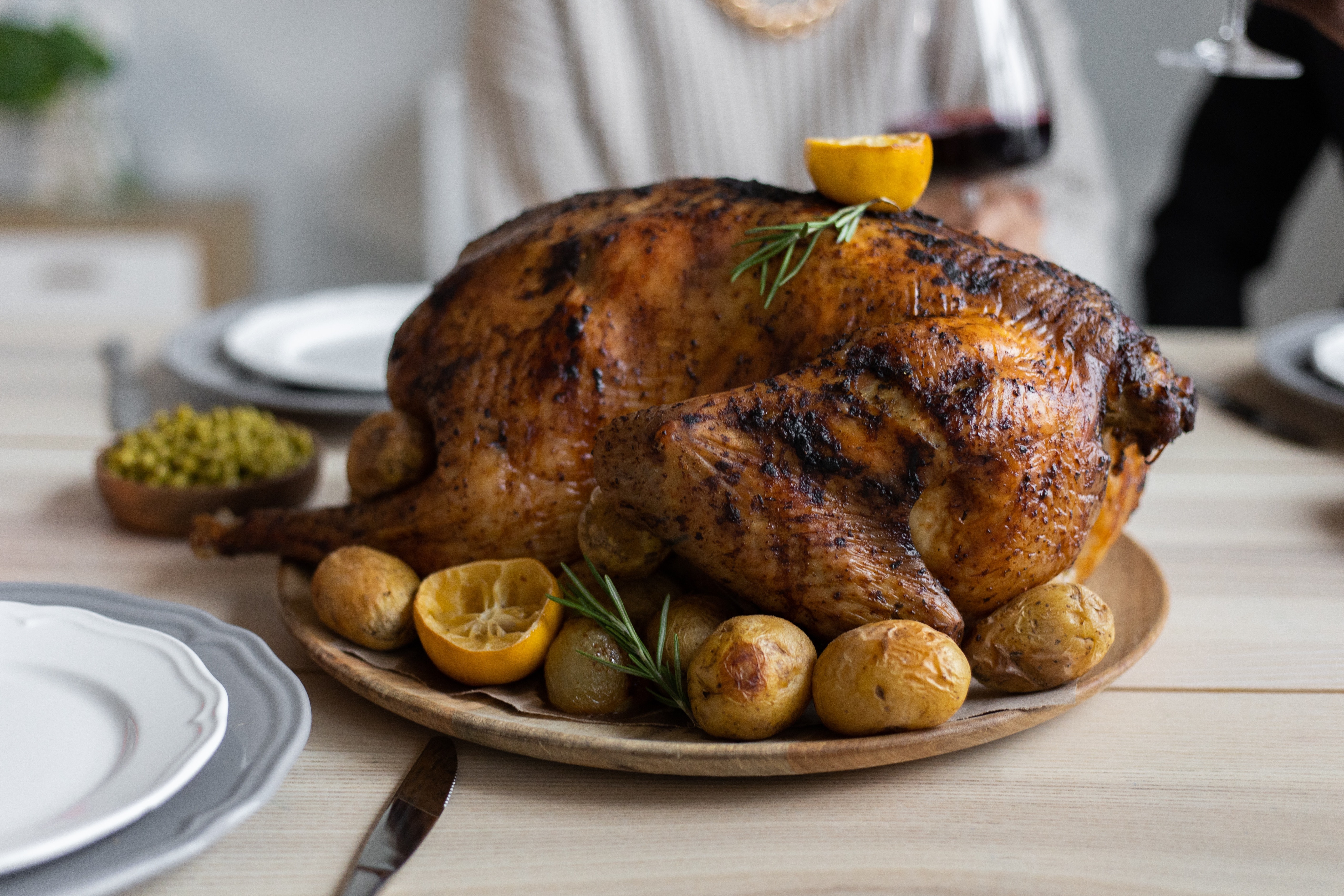 A cooked Thanksgiving turkey on a plate.