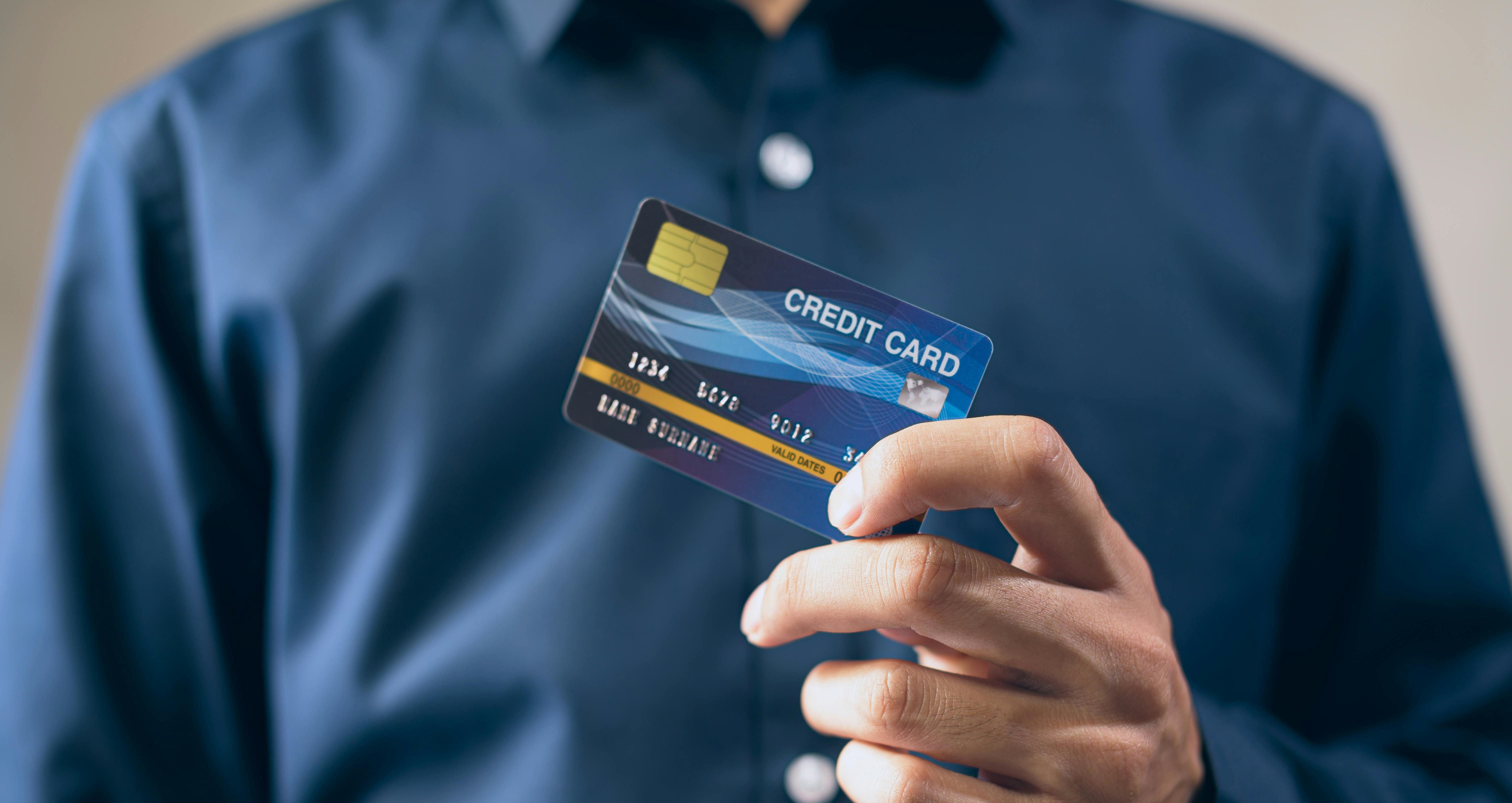 Man holding a credit card.