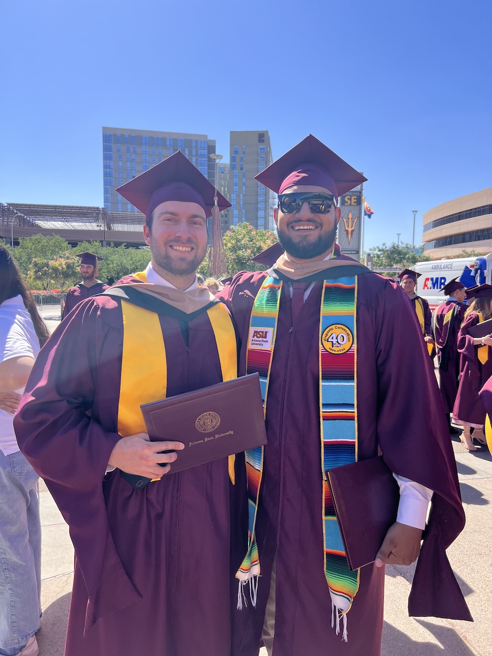 MACC alum Everson Wimer at graduation with a classmate