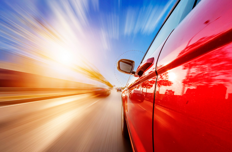 Red-car-on-highway-IDEAS.jpg Red-car-on-highway-IDEAS.jpg